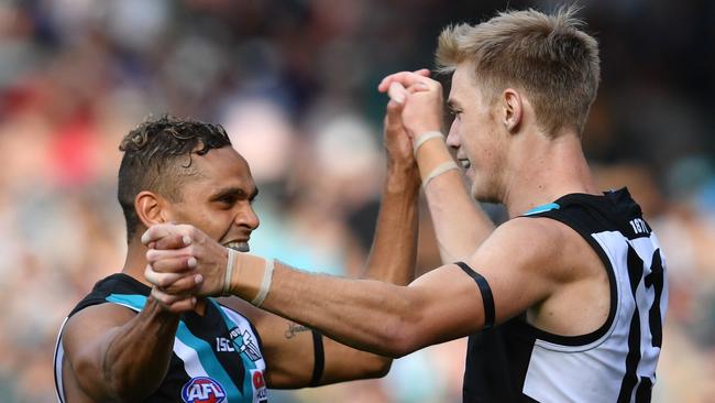 Todd Marshall and Dom Barry celebrate a goal on Saturday. Picture: AAP Image/David Mariuz