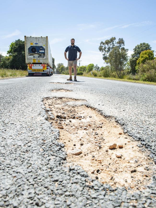 Valley Pack transport business owner Taylor Hall on the badly damaged Murchison-Tatura Road. PICTURE: ZOE PHILLIPS