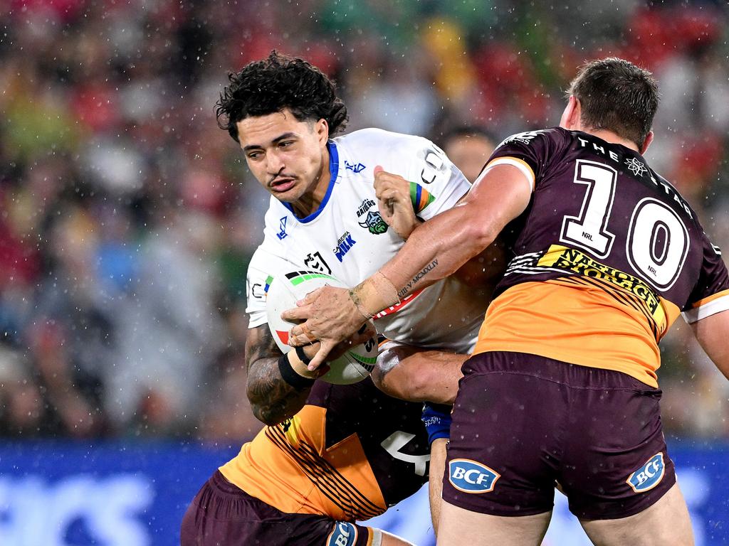 Xavier Savage of the Raiders is tackled. Photo: Bradley Kanaris/Getty Images