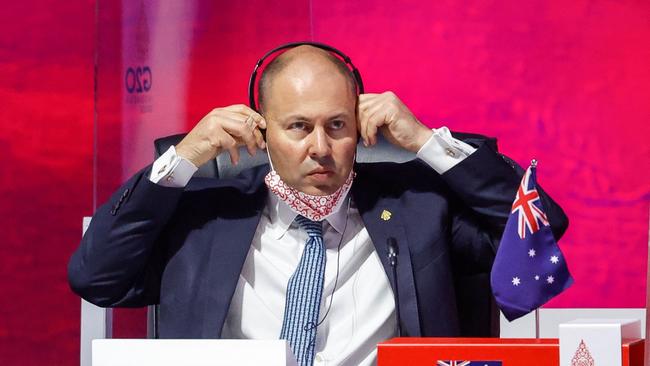 Treasurer Josh Frydenberg adjusts his headphone during the opening ceremony of the G20 finance ministers and central bank governors meeting in Jakarta.