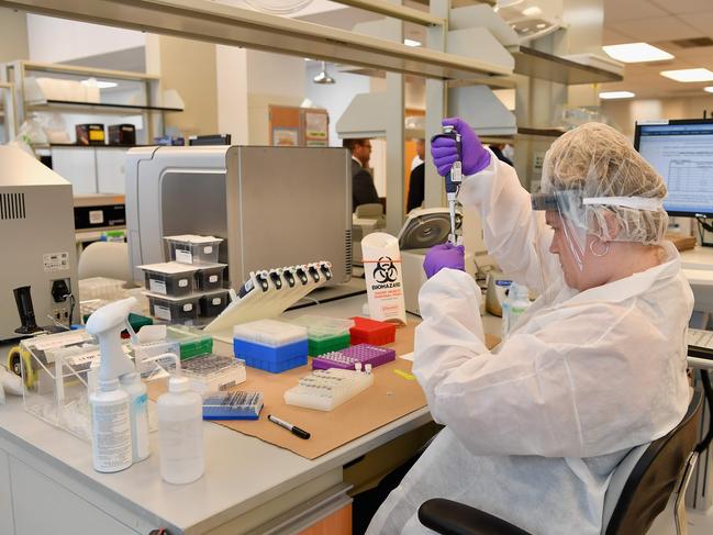 A lab worker transfers solutions from one tube to another as the New York City Office of Chief Medical Examiner hosts A DNA Extraction demonstration to unveil groundbreaking technology. Picture: AFP