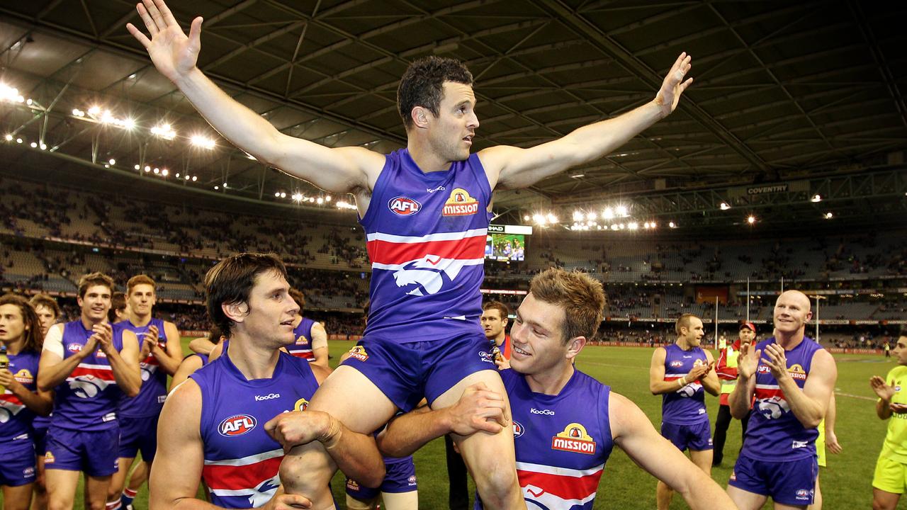Gilbee getting chaired of Etihad Stadium after playing his 200th game