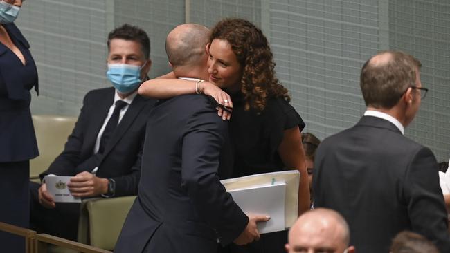 Treasurer Josh Frydenberg embraces his wife Amie before delivering the budget in the House of Representatives.