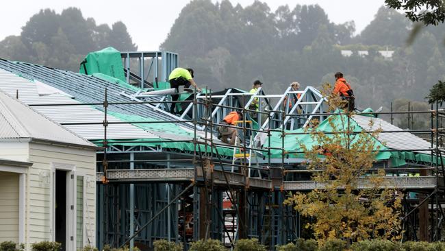 Roofers get to work. Picture: David Geraghty.