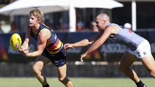 Rory Sloane escapes Dan Houston’s clutches during the JLT Series. Picture: Sarah Reed