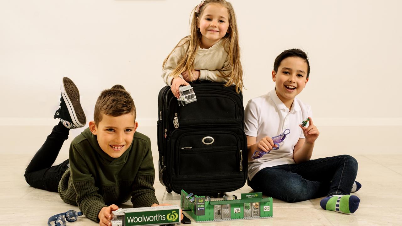 Axel Gikas, 9, Alice Murphy, 6, Edward Lam, 9, test out Woolworths’ newest collectibles. Picture: Supplied