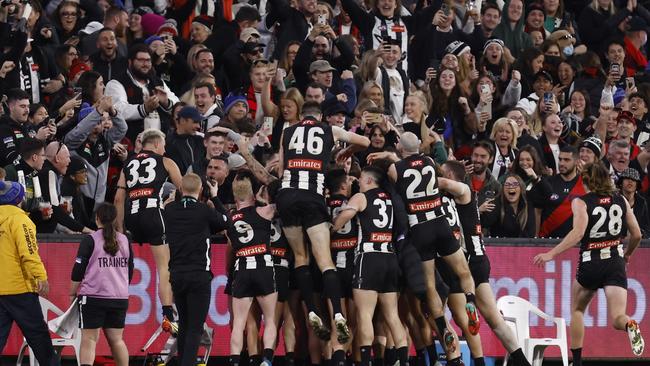 Collingwood players celebrate their incredible victory. Picture: Darrian Traynor/Getty Images