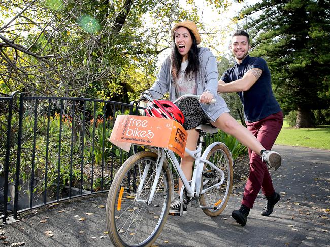 Backpackers Sara Veraldi and Emanuele Tonon ride a bike through the Botanic Garden. Pic: Mike Burton