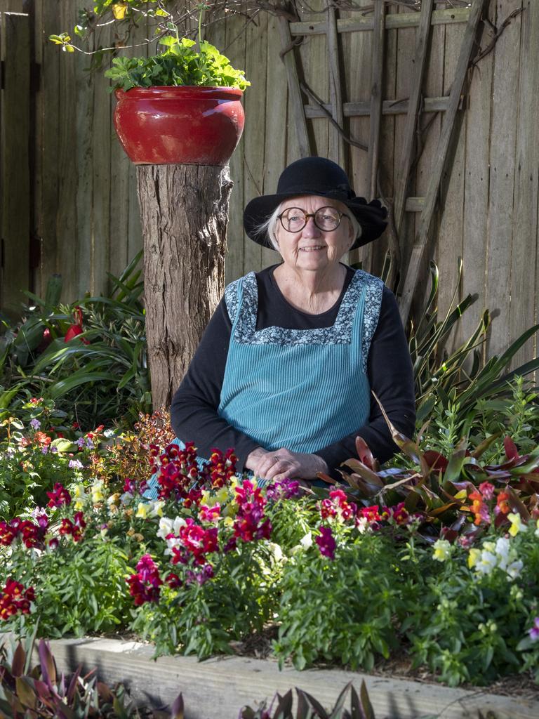 Martha Collier relaxes in her Chronicle Garden Competition entered garden. Picture: Nev Madsen.