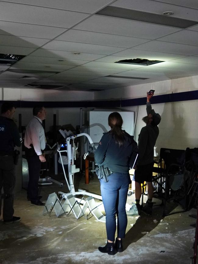 Police inside one of the squatter buildings. Picture: Sean Garnsworthy/AAP