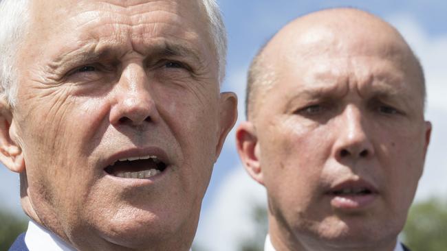 Australian Prime Minister Malcolm Turnbull (left) and Member for Dickson Peter Dutton speak to media in Murrumba Downs, Brisbane, Tuesday, April 3, 2018. Mr Turnbull announced funding for a $150 million upgrade to the Bruce Highway. (AAP Image/Glenn Hunt) NO ARCHIVING, EDITORIAL USE ONLY