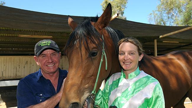 Alice Springs jockey Kacie Connor and husband Greg with ExtraCeed. Picture: PHIL WILLIAMS