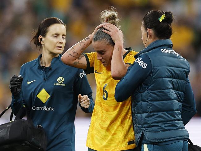 Chloe Logarzo is forced from the field after a heavy head clash. Picture: Getty Images