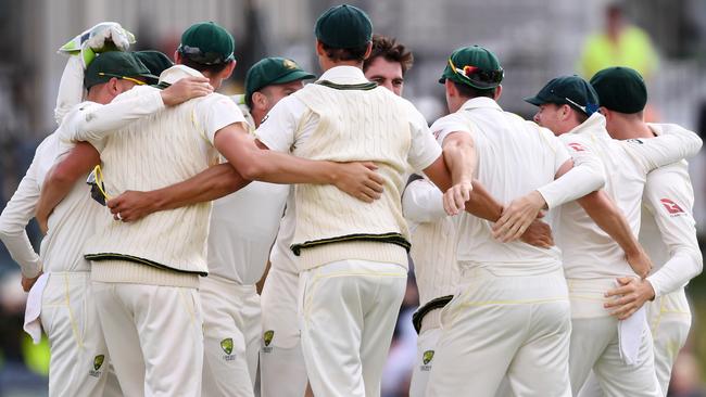 Australian players celebrate their Ashes victory on Monday.