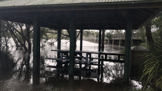 A picnic area close to the dam wall at the Manly Dam reservoir at Manly Vale was inundated by floodwaters on Monday. Picture: Jim O'Rourke