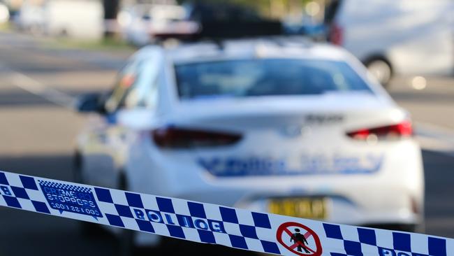 SYDNEY, AUSTRALIA - NEWSWIRE PHOTOS June 14 2022: A general stock image of a Police tape in front of a Police car in Sydney. Picture NCA Newswire/ Gaye Gerard.