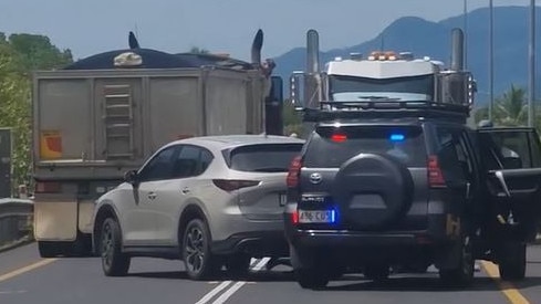 Two trucks have blocked an allegedly stolen vehicle from evading police in Cairns on Saturday morning. Image: Supplied.