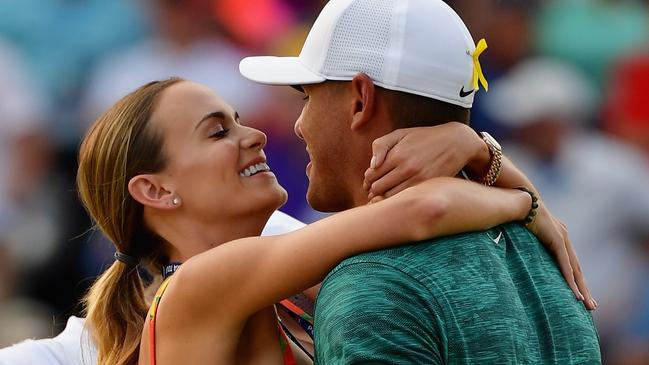 Brooks Koepka kisses girlfriend, Jena Sims, after winning the 2018 PGA Championship.