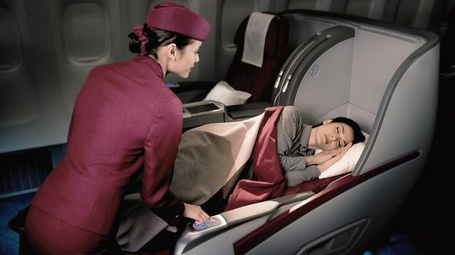 Qatar Airways’ older style business class which will be on aircraft to be used as Virgin Australia services to Doha from mid-2025. Picture: Qatar Airways