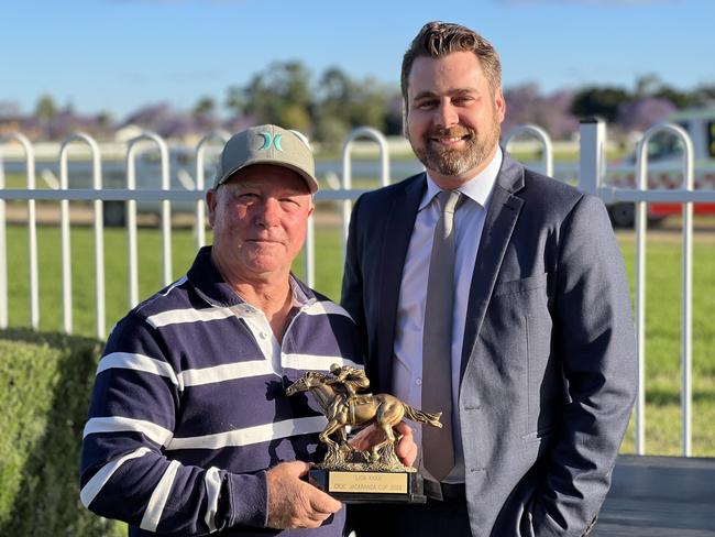 Port Macquarie-based trainer John Sprague is presented with the 2022 Grafton Jacaranda Cup after his win with Crowned Empress.