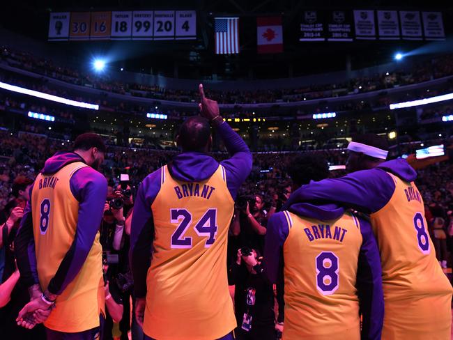 From left: Anthony Davis, LeBron James, Quinn Cook and Kentavious Caldwell-Pope of the Los Angeles Lakers during the tribute to Kobe. Picture: Harry How/Getty