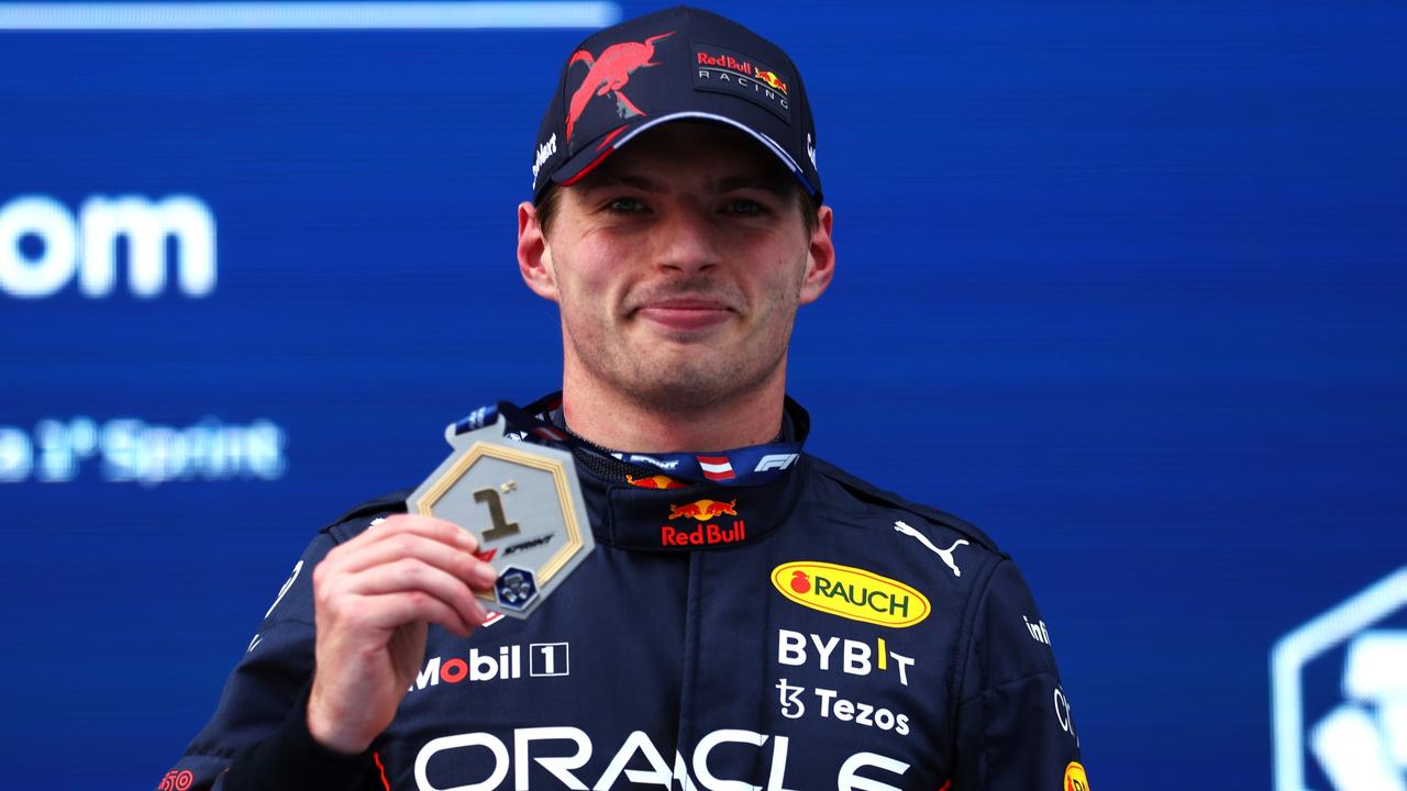 SPIELBERG, AUSTRIA - JULY 09: Sprint winner Max Verstappen of the Netherlands and Oracle Red Bull Racing celebrates with his medal during the F1 Grand Prix of Austria Sprint at Red Bull Ring on July 09, 2022 in Spielberg, Austria. (Photo by Bryn Lennon/Getty Images)