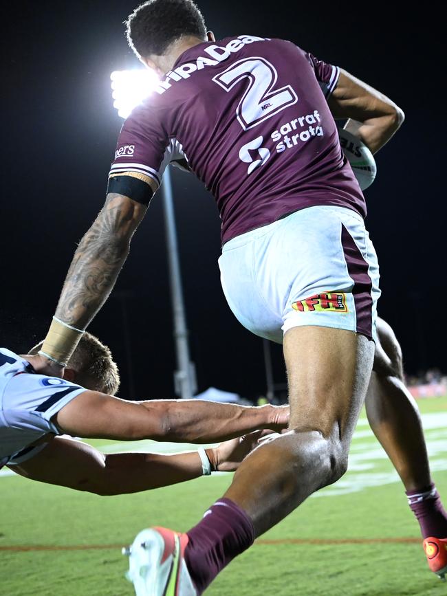 Jason Saab races away to score another try for Manly.