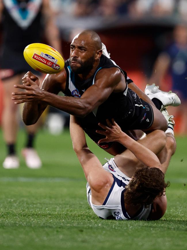 Esava Ratugolea of the Power is tackled. Picture: Michael Willson/AFL Photos via Getty Images)