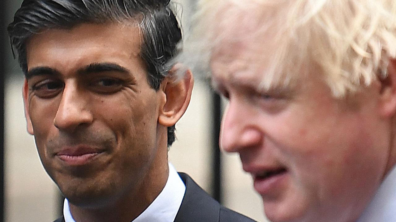 Prime Minister Boris Johnson with Chancellor of the Exchequer Rishi Sunak. (Photo by Daniel LEAL / AFP)