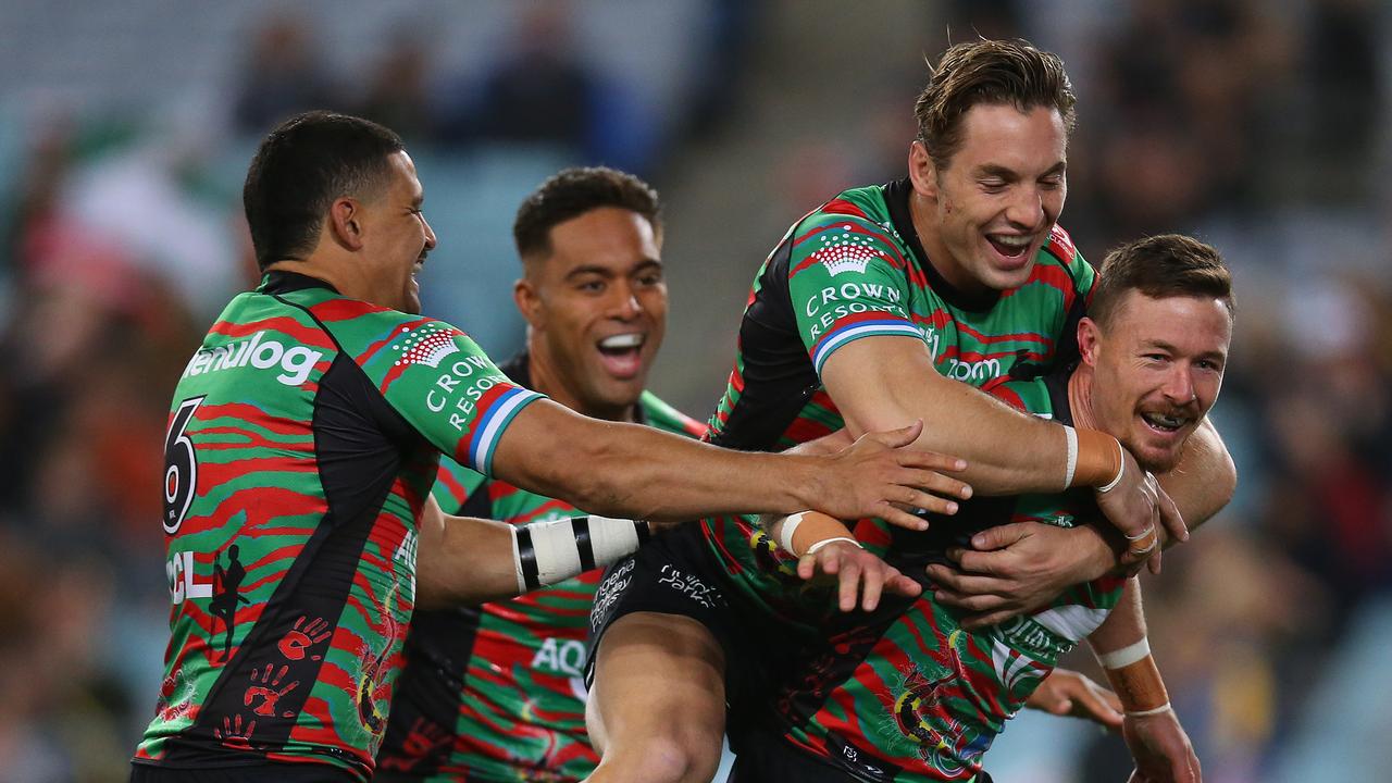 SYDNEY, AUSTRALIA - MAY 29: Damien Cook of the Rabbitohs celebrates after scoring a try during the round 12 NRL match between the South Sydney Rabbitohs and the Parramatta Eels at Stadium Australia, on May 29, 2021, in Sydney, Australia. (Photo by Jason McCawley/Getty Images)