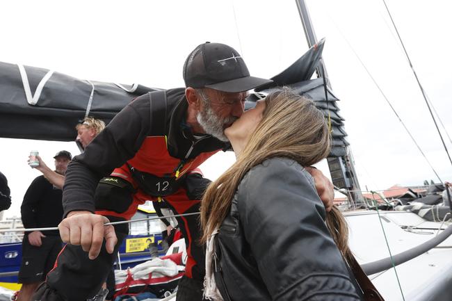 Alive skipper Duncan Hine kisses wife Kate as Alive claimed line honours in the 2020 Launceston to Hobart yacht race. Picture: Zak Simmonds