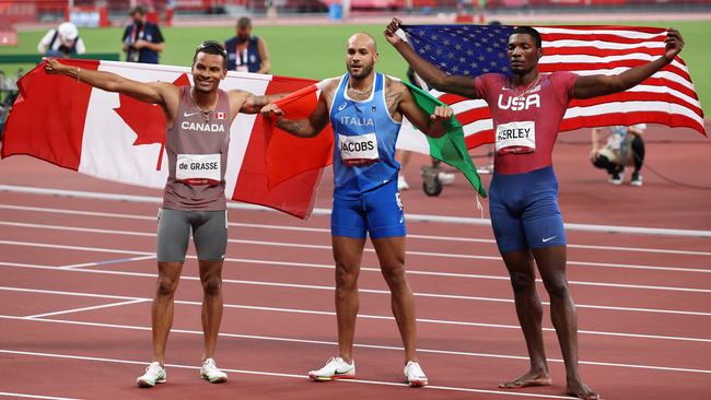 Andre de Grasse, Lamont Marcell Jacobs and Fred Kerley pose after the race. (Photo by Ian MacNicol/Getty Images)