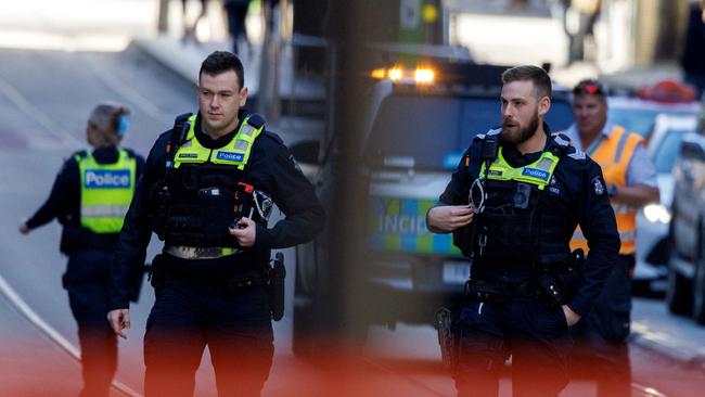 Police swarmed the street about midday on Wednesday. Picture: David Geraghty / NewsWire