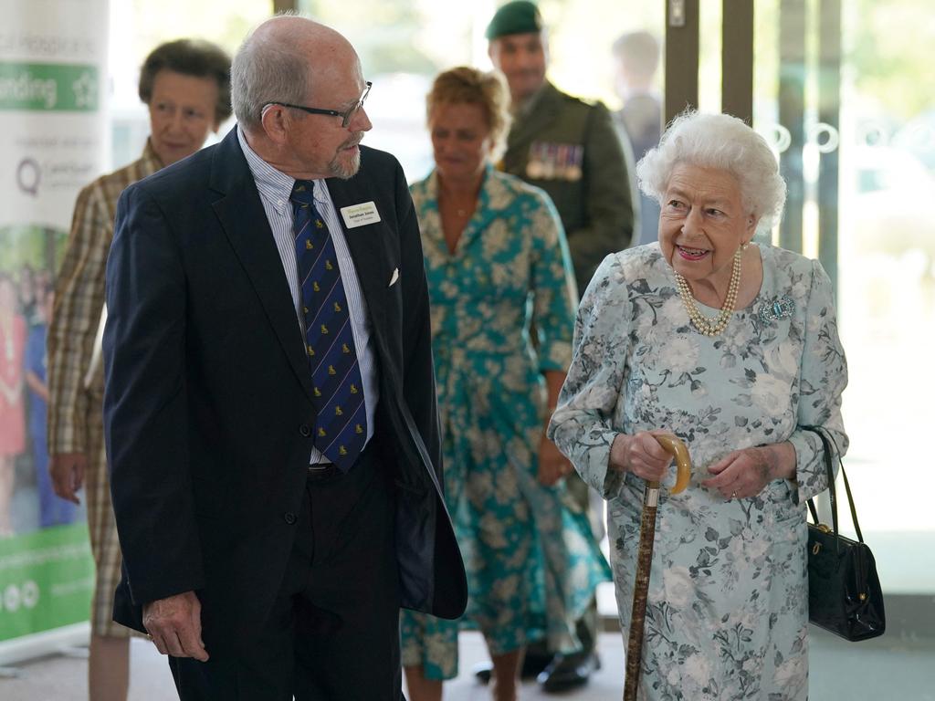 Britain's Queen Elizabeth II walks with Jonathan Jones during a visit to officially open the new building of Thames Hospice in Maidenhead. Picture: AFP