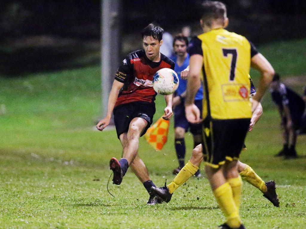 Leichhardt's Nazario Lim kicks left footed to set Josh Wilson up for a match equalling goal in the FNQ Football premiership men's match between the Leichhardt Lions and the Edge Hill Tigers, held at Johnson Road Oval, White Rock. Picture: Brendan Radke