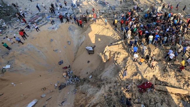 A crater blown out by an Israeli airstrike in Khan Yunis on Monday. Picture: AFP