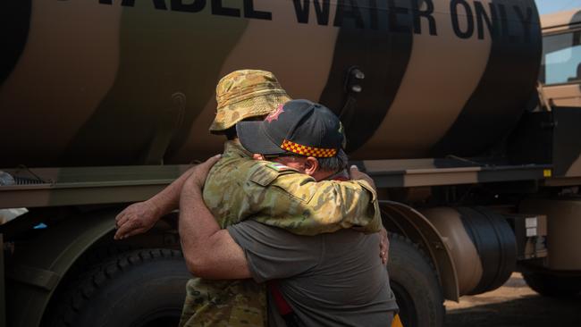 Army Reservist Johannes Schoeman gets a hug from CFS volunteer Dick Biles at Parndana CFS station. Picture: Brad Fleet