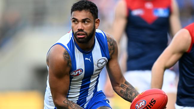 HOBART, AUSTRALIA - AUGUST 06: Tarryn Thomas of the Kangaroos runs the ball during the round 21 AFL match between North Melbourne Kangaroos and Melbourne Demons at Blundstone Arena, on August 06, 2023, in Hobart, Australia. (Photo by Steve Bell/Getty Images)