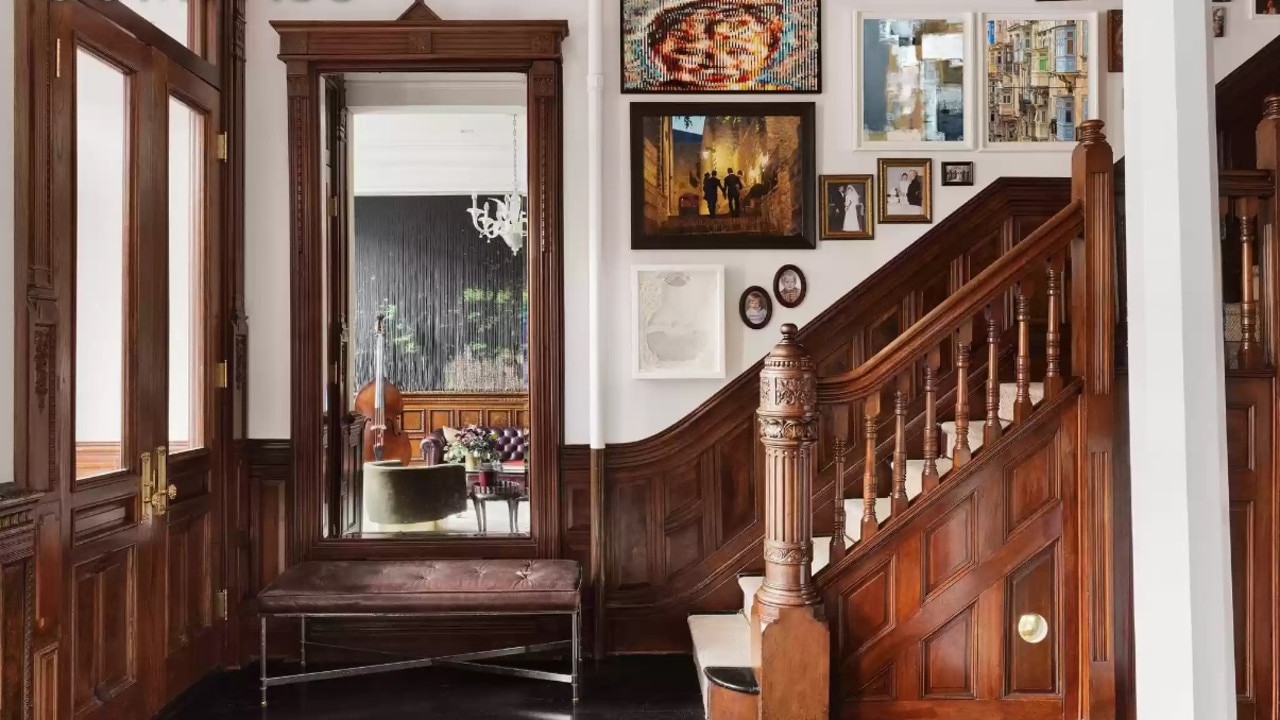 The entrance is filled with rich wood fixtures. Picture: Realtor/Compass