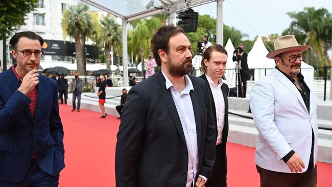 Australian screenwriter Shaun Grant, Australian director Justin Kurzel, Us actor Caleb Landry Jones and producer Nick Batzias arrive for the screening of the film Nitram at the 74th edition of the Cannes Film Festival in Cannes. (Photo by CHRISTOPHE SIMON / AFP)