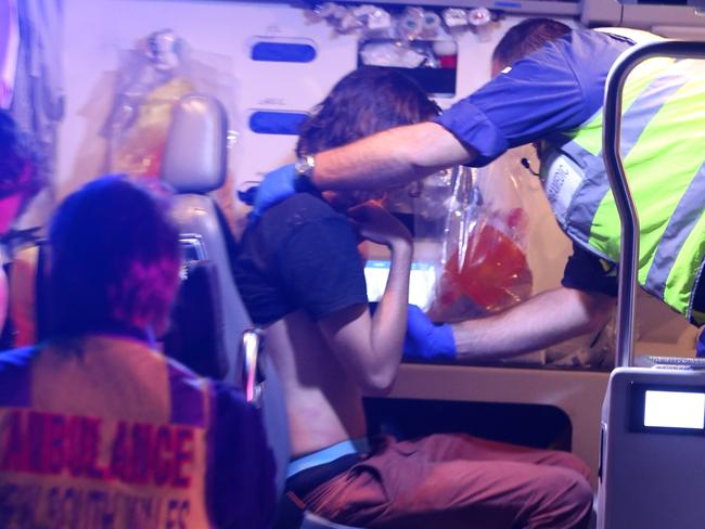 One of the youths is treated by paramedic. Picture: John Grainger