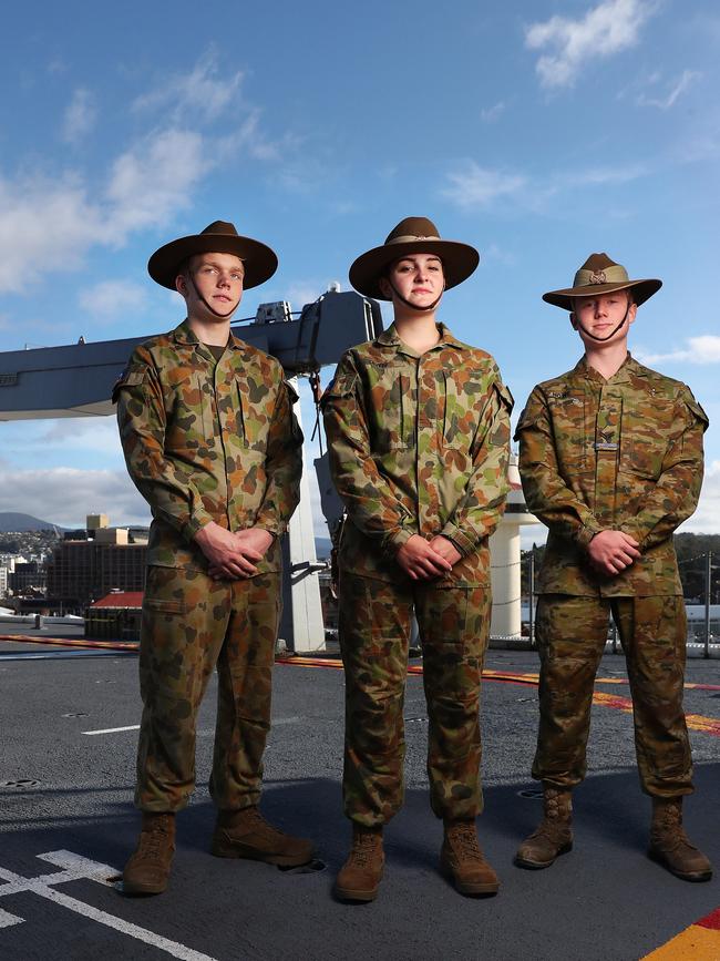 Aboard the HMAS Adelaide are army cadets Jason Millard 14 cadet of Hobart, Indigo Lewis 15 cadet of Hobart, Hunter Howe 16 cadet corporal of Hobart. HMAS Adelaide, HMAS Sydney and HMAS Brisbane are all in Hobart. Picture: Nikki Davis-Jones