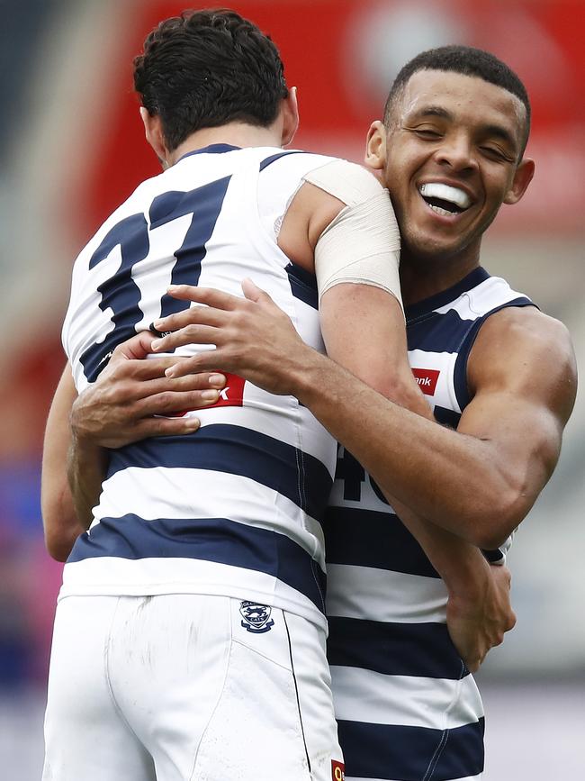 Returning Sam Simpson enjoys a goal with Stefan Okunbor. Picture: Daniel Pockett/AFL Photos/via Getty Images