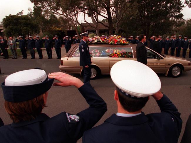 Victorian police officers form an honour guard outside the Police Academy chapel in Glen Waverley after the funeral for Sergeant Gary Silk.