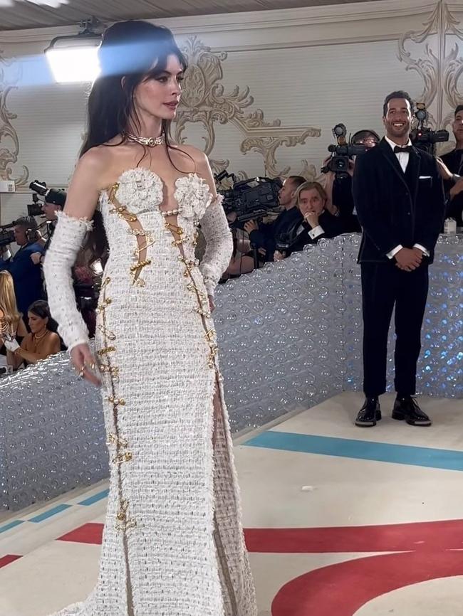 Actor Anne Hathaway on the red carpet at the 2023 Met Gala, as Formula One driver Daniel Ricciardo looks on. Photo: Twitter