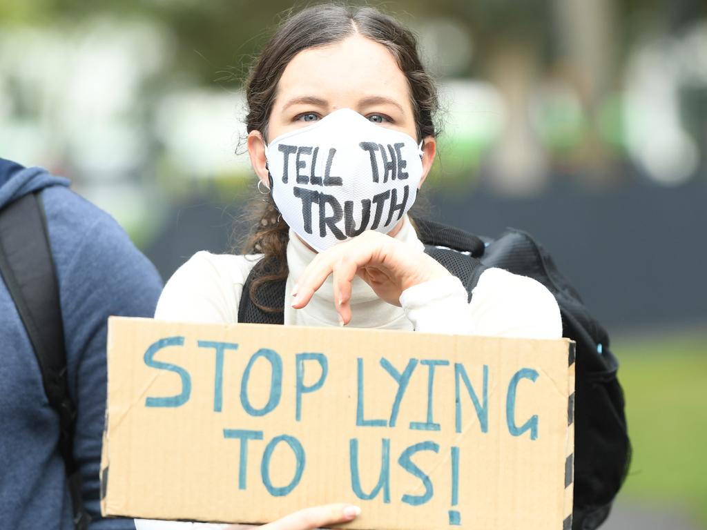 An activists from Extinction Rebellion participates in a protest in Melbourne, Thursday, October 10, 2019. The Extinction Rebellion climate protests movement has planned a "spring rebellion" from Monday to Sunday, including marches aimed at blocking traffic. (AAP Image/Erik Anderson) NO ARCHIVING