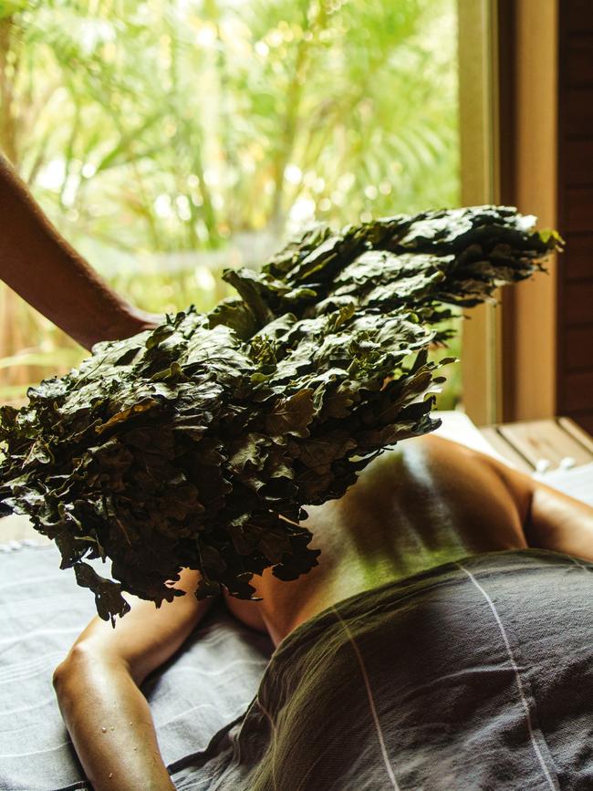 A banya treatment combines heat therapy, cold plunges and aromatherapy with oak leaves.