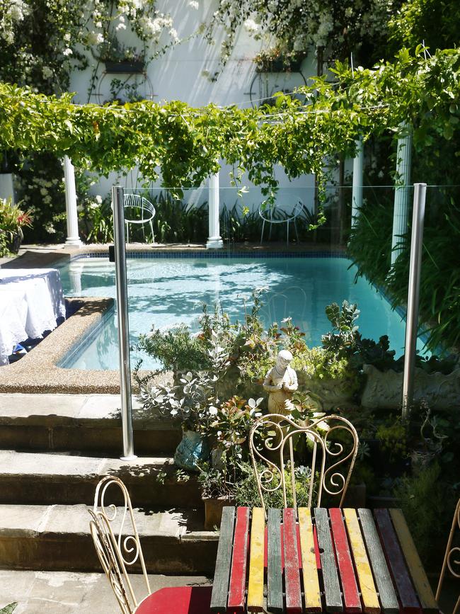 Rear courtyard and pool area which features columns and a passionfruit vine. Picture: John Appleyard