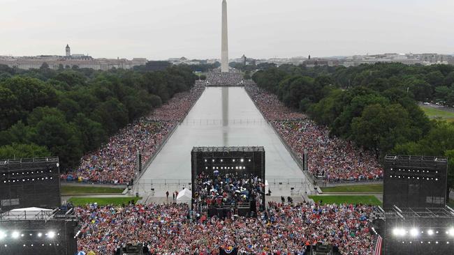 Crowds braved the rain to listen to the speech. Picture: AFP.