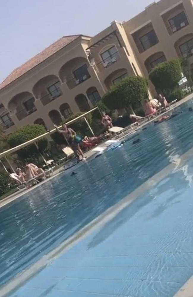 The woman was filmed throwing her 'cheating' partner's belongings into the swimming pool in Egypt.